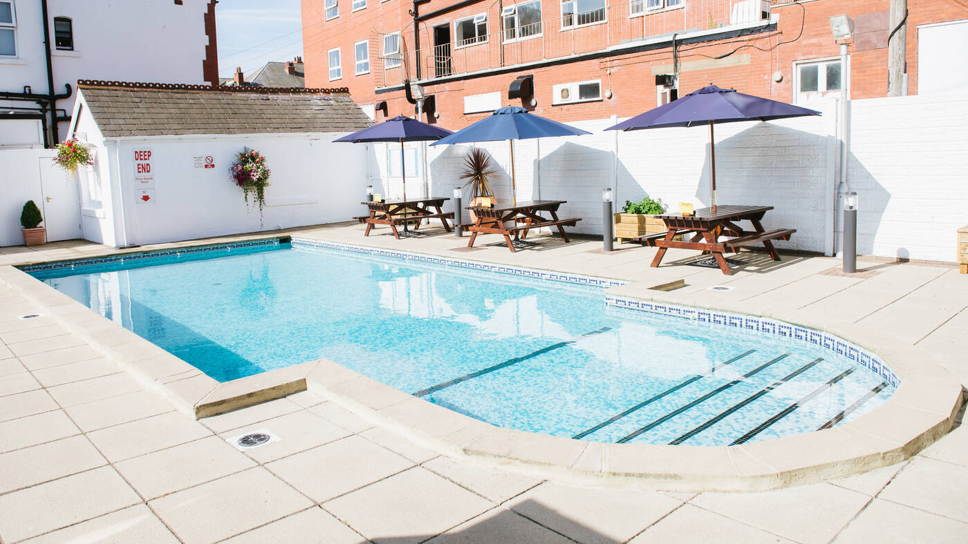 The outdoor pool and sun patio at the Doric Hotel