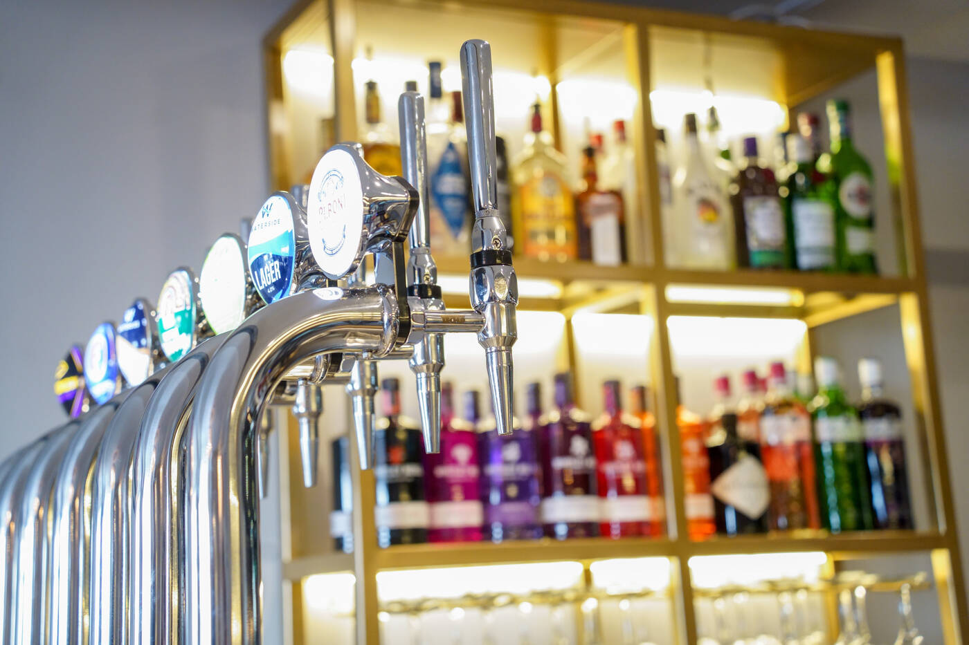 The bar — taps and the gold back bar