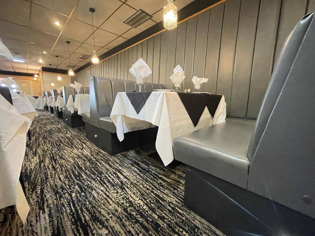 Booth seating in the restaurant at the Doric Hotel