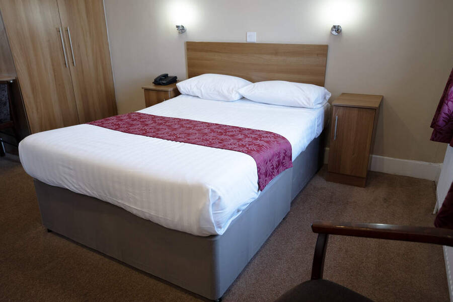 A bedroom at the Doric Hotel